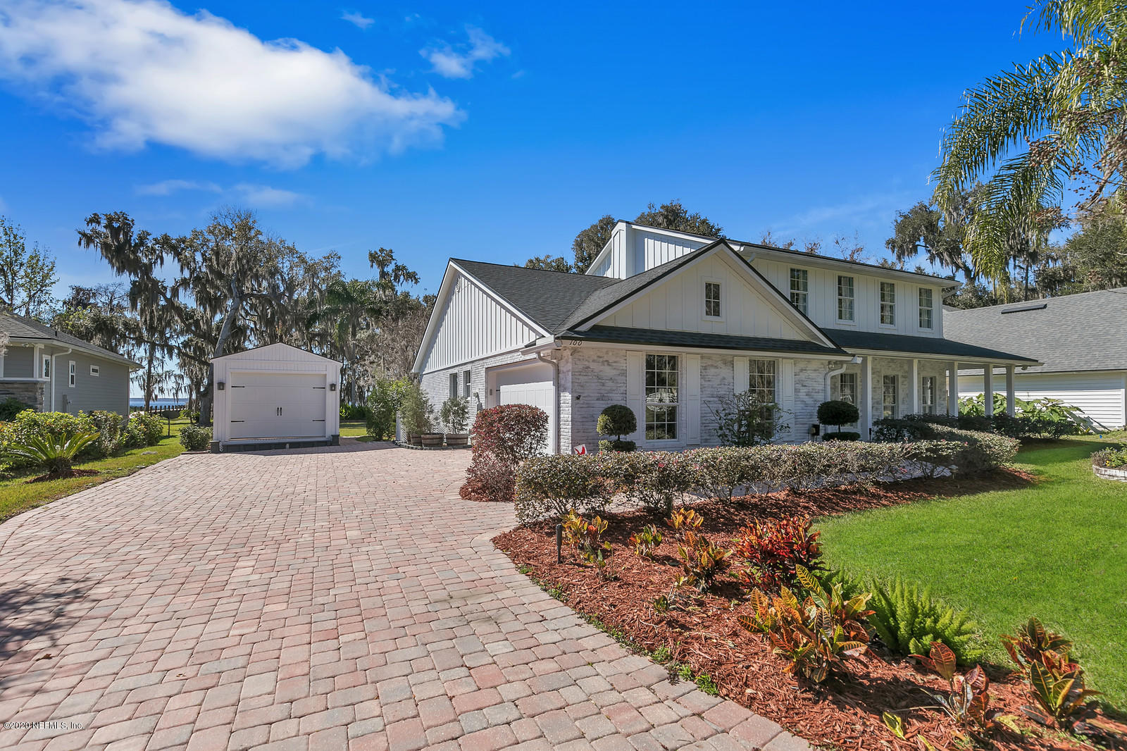100 River's Edge Road North St. Augustine, FL 32092 - Photo 7 of 67 a front view of a house with a garden and yard