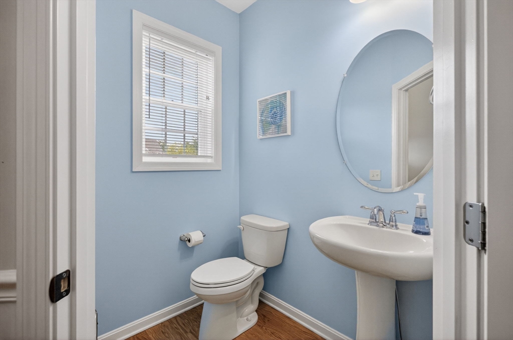87 Shannon Way, Unit 86 Upton, MA 01568 - Photo 31 of 36 a bathroom with a sink toilet and a mirror