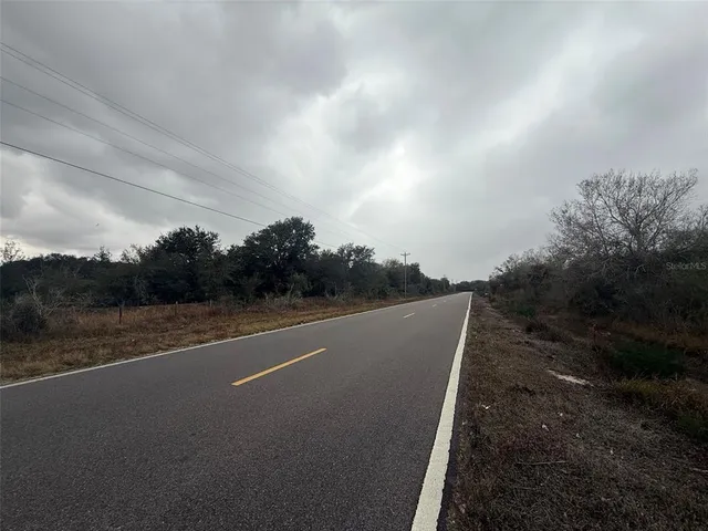 a view of a city street from a yard