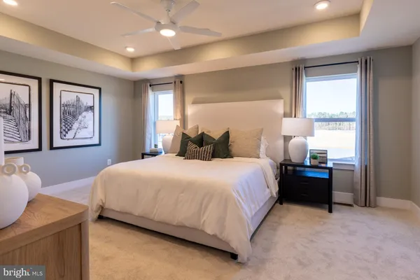 a bedroom with a bed and a couch