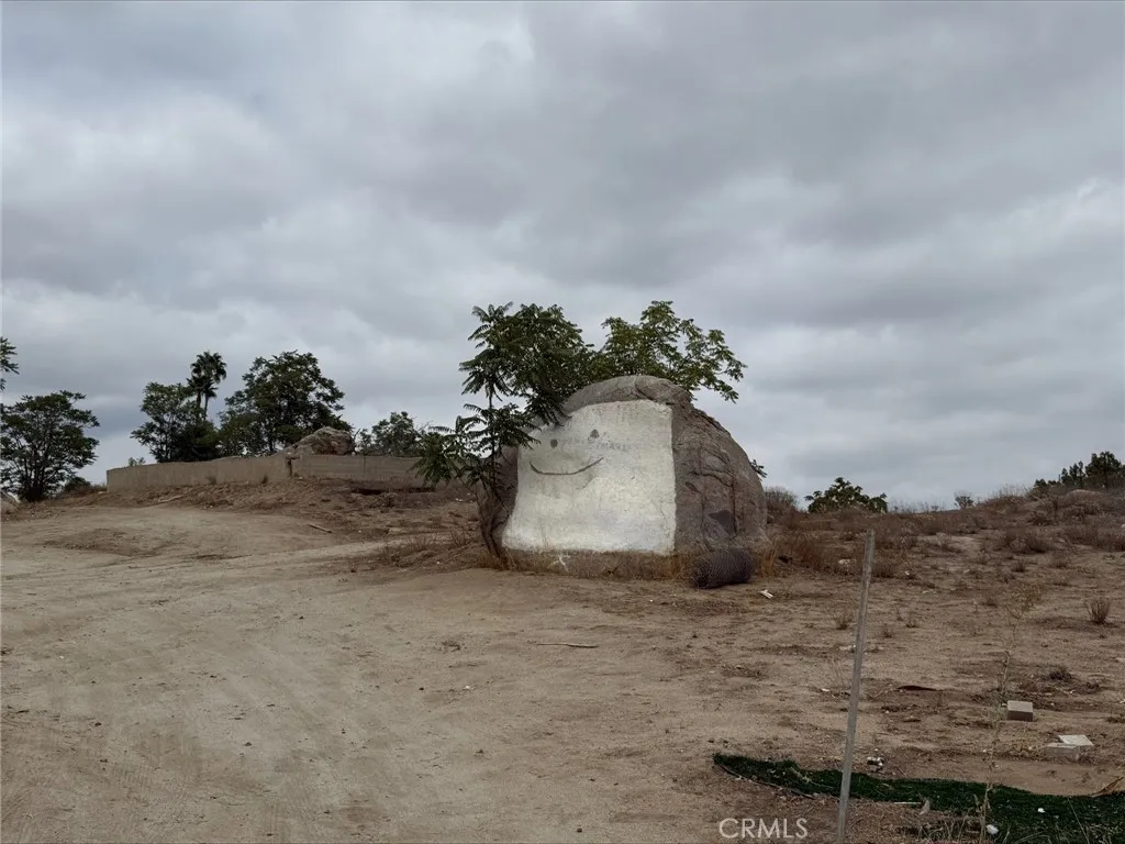 0 State Highway Perris, CA 92570 - Photo 4 of 17 a view of a dry yard with wooden fence