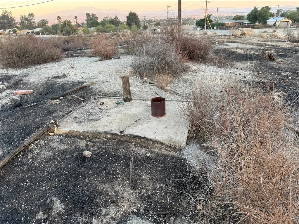 0 State Highway Perris, CA 92570 - Photo 10 of 17 a view of a dry yard with wooden fence