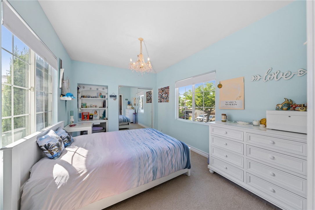 23 Winslow Street Ladera Ranch, CA 92694 - Photo 24 of 47 a bedroom with a bed and large windows