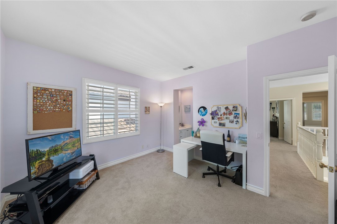 23 Winslow Street Ladera Ranch, CA 92694 - Photo 26 of 47 a living room with furniture a flat screen tv and a window