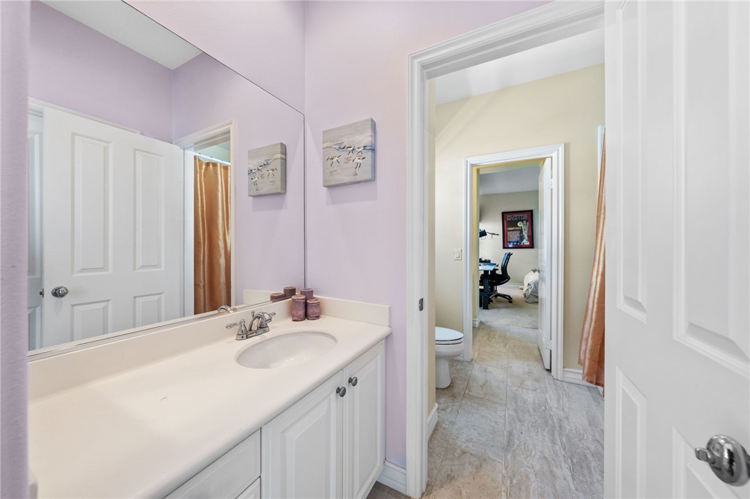 23 Winslow Street Ladera Ranch, CA 92694 - Photo 29 of 47 a spacious bathroom with a sink and a mirror