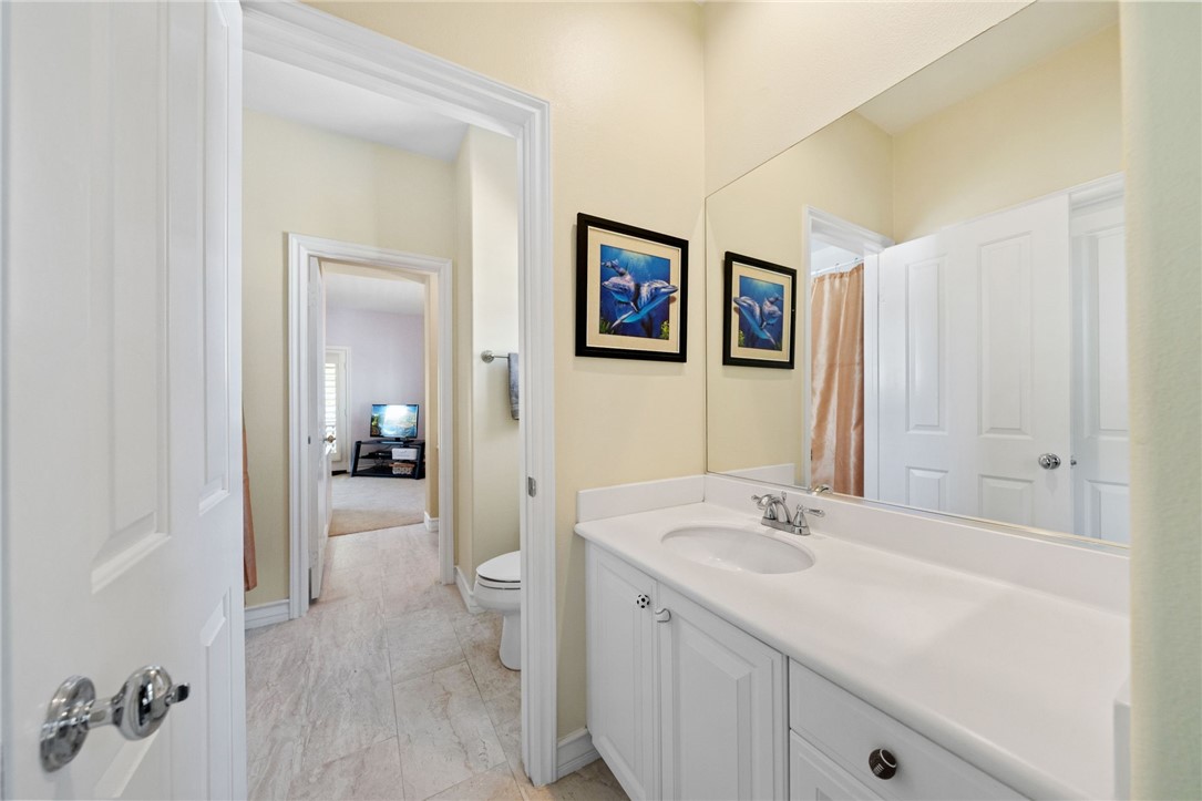 23 Winslow Street Ladera Ranch, CA 92694 - Photo 31 of 47 a en suite bathroom with a sink mirror and a shower