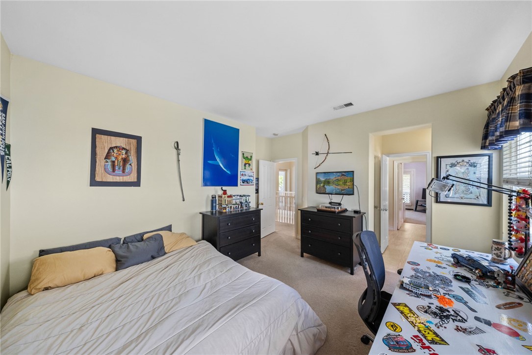 23 Winslow Street Ladera Ranch, CA 92694 - Photo 32 of 47 a bedroom with a bed and furniture