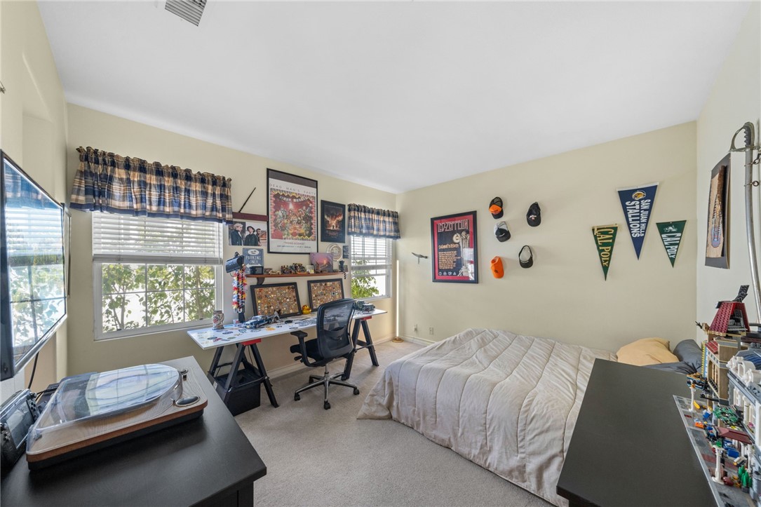 23 Winslow Street Ladera Ranch, CA 92694 - Photo 33 of 47 a bedroom with furniture and a window