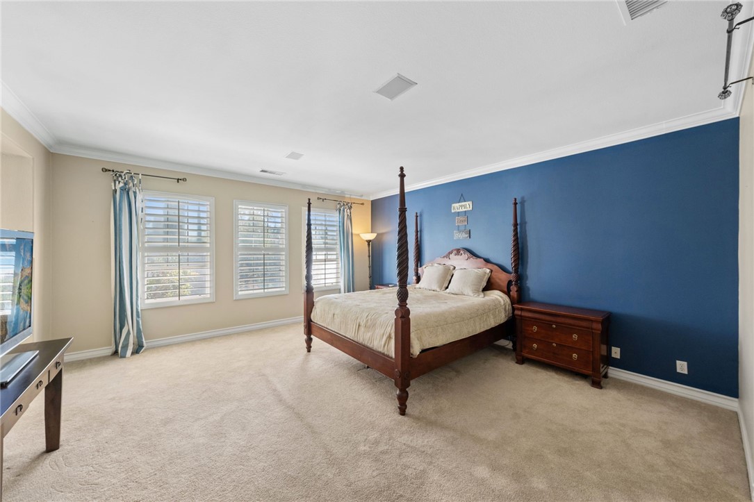 23 Winslow Street Ladera Ranch, CA 92694 - Photo 36 of 47 a bedroom with a bed and large windows