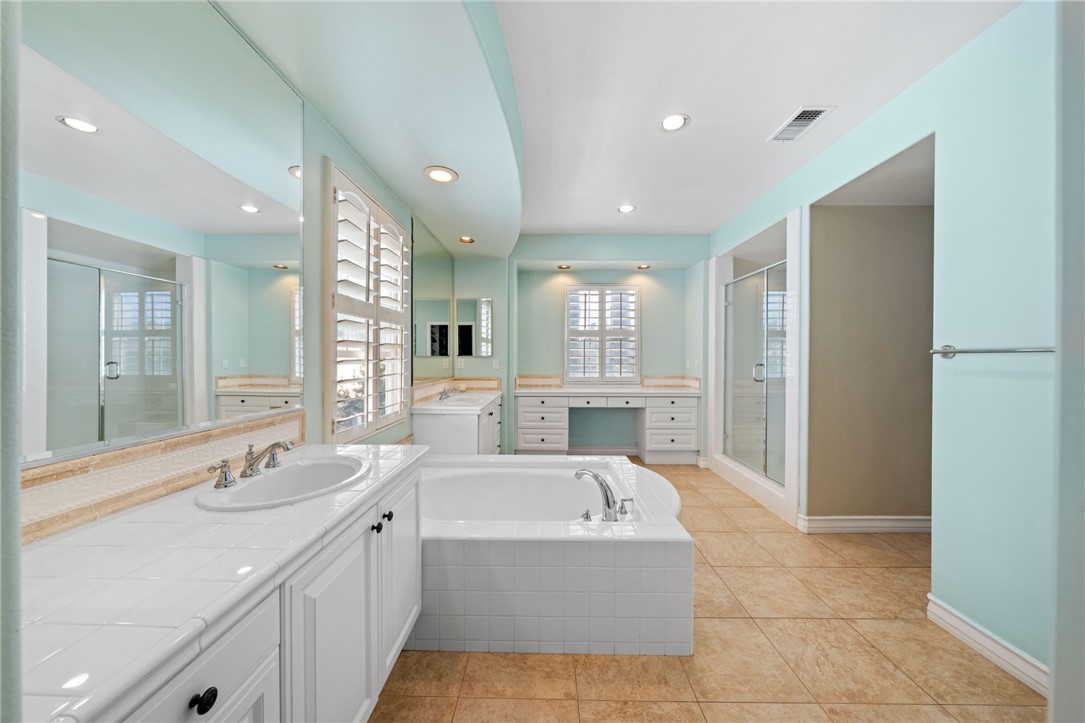 23 Winslow Street Ladera Ranch, CA 92694 - Photo 39 of 47 a large bathroom with a large tub sink shower and mirror