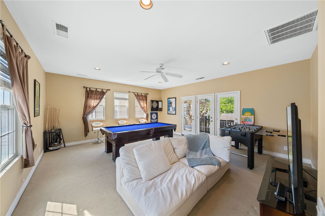 23 Winslow Street Ladera Ranch, CA 92694 - Photo 42 of 47 a living room with furniture and a flat screen tv