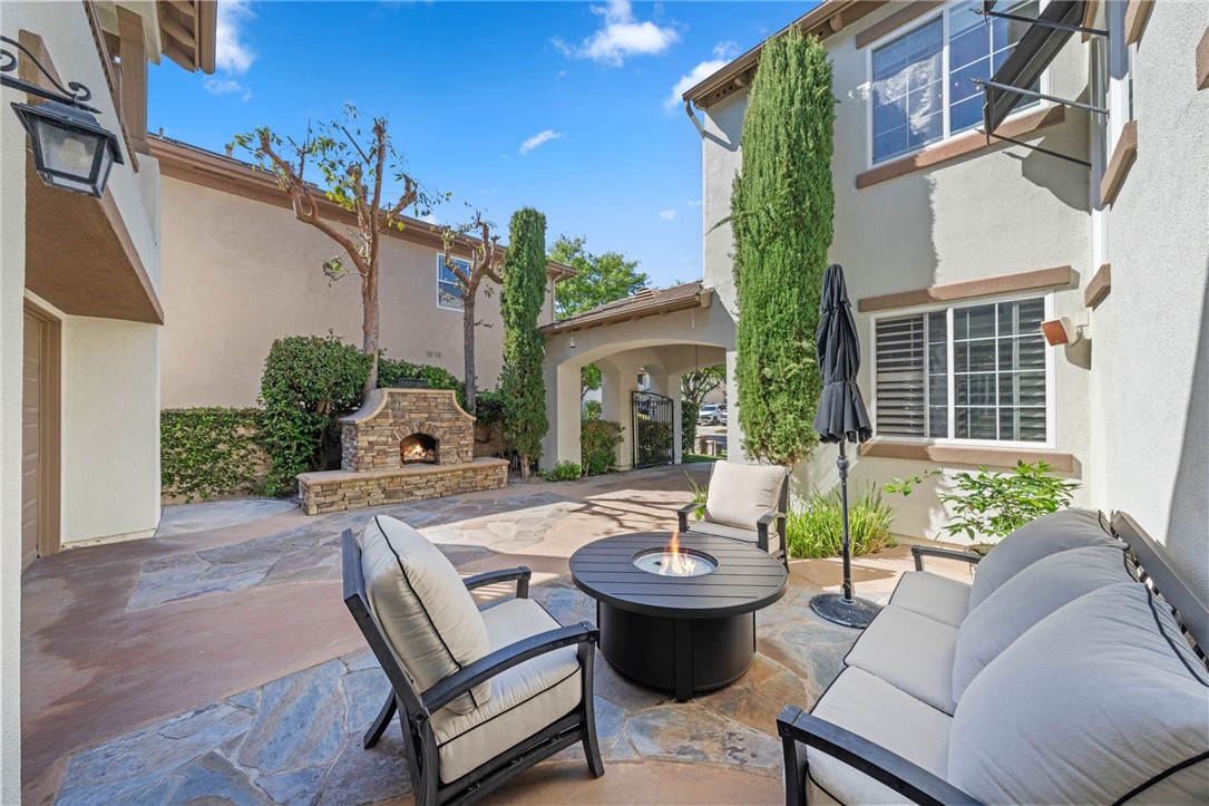 23 Winslow Street Ladera Ranch, CA 92694 - Photo 45 of 47 a view of a patio with couches table and chairs and potted plants