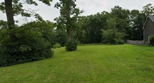 a view of an outdoor space and a yard