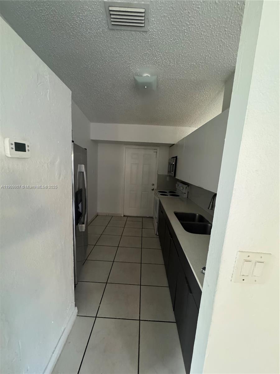 20769 Northwest 41st Avenue Miami Gardens, FL 33055 - Photo 11 of 19 a kitchen with a stove