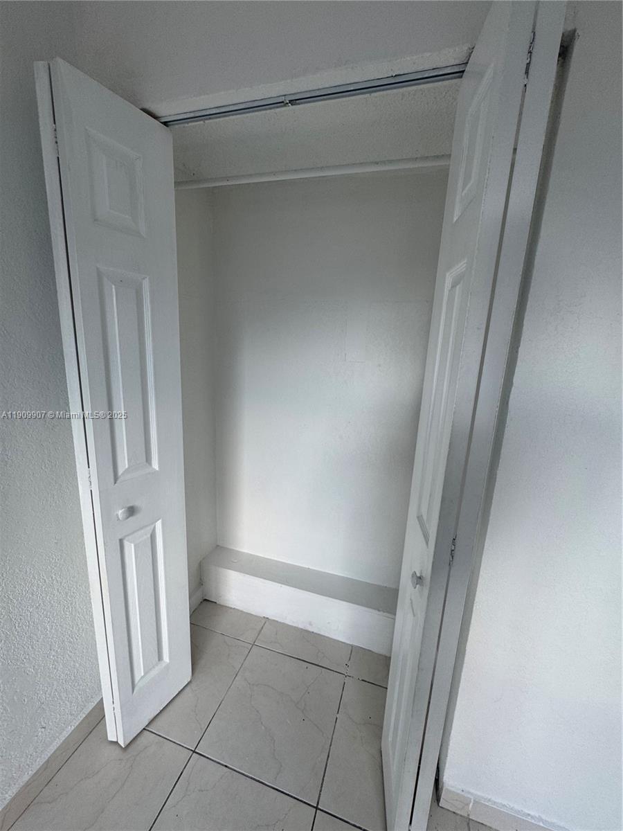20769 Northwest 41st Avenue Miami Gardens, FL 33055 - Photo 13 of 19 a view of an empty walk in closet