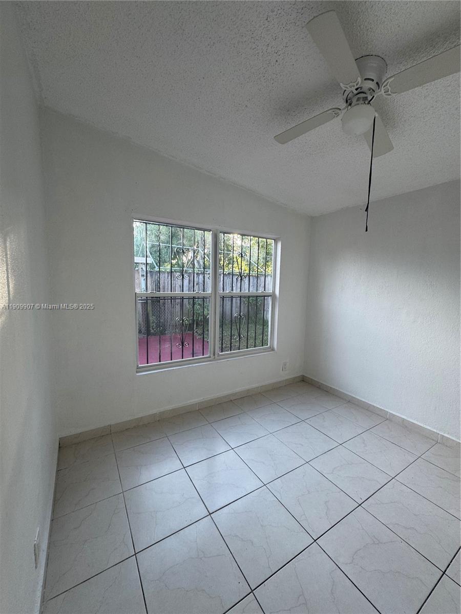 20769 Northwest 41st Avenue Miami Gardens, FL 33055 - Photo 14 of 19 a view of an empty room with a window