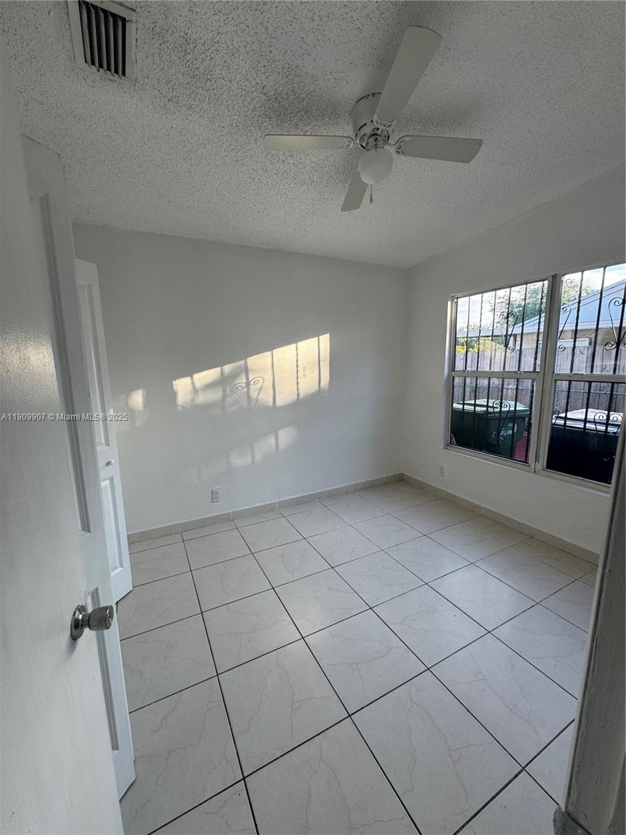 20769 Northwest 41st Avenue Miami Gardens, FL 33055 - Photo 18 of 19 a view of an empty room and window