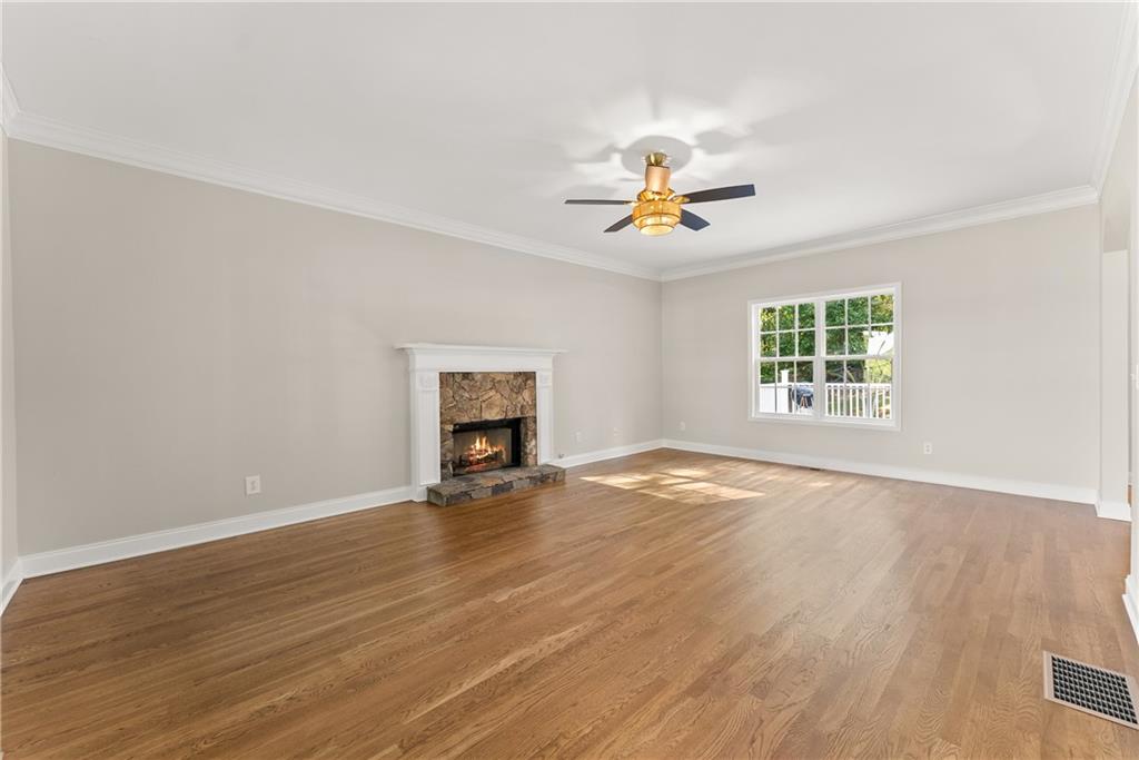 41 Doster Crest Road Jefferson, GA 30549 - Photo 12 of 56 an empty room with windows and ceiling fan