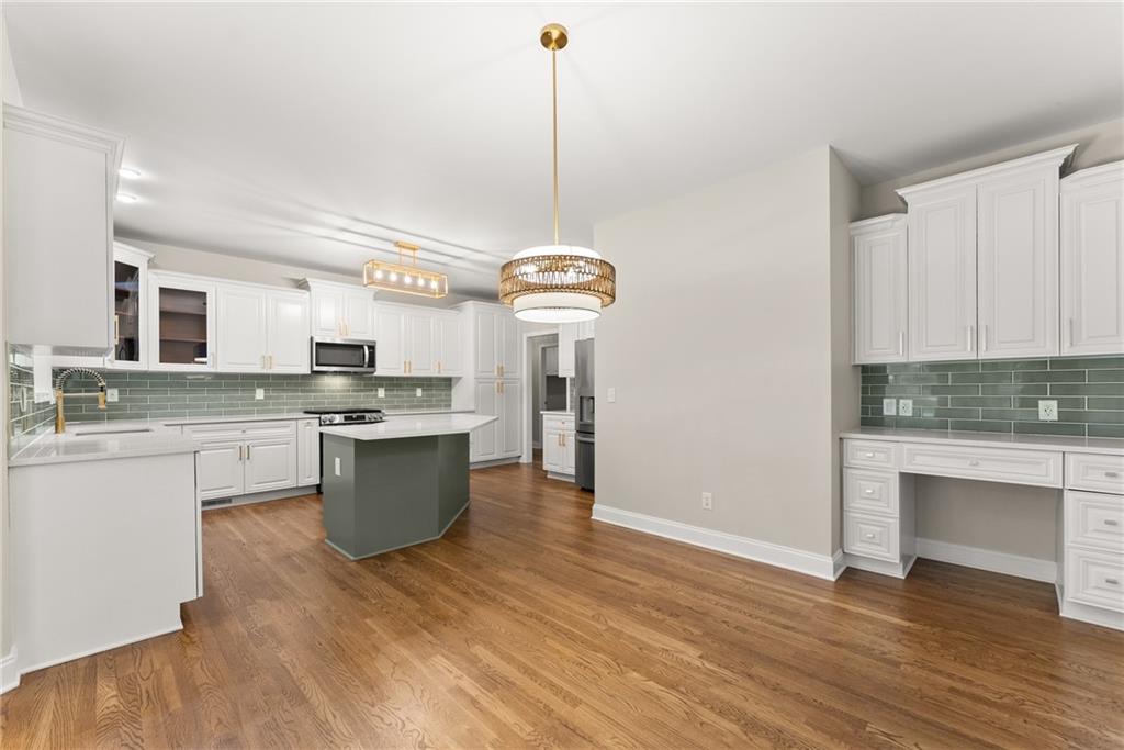 41 Doster Crest Road Jefferson, GA 30549 - Photo 15 of 56 a large kitchen with granite countertop white cabinets and white appliances
