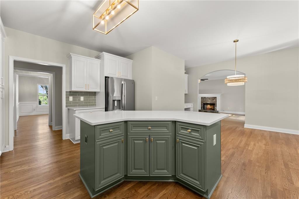41 Doster Crest Road Jefferson, GA 30549 - Photo 17 of 56 a kitchen with stainless steel appliances granite countertop a sink a stove and a wooden floors