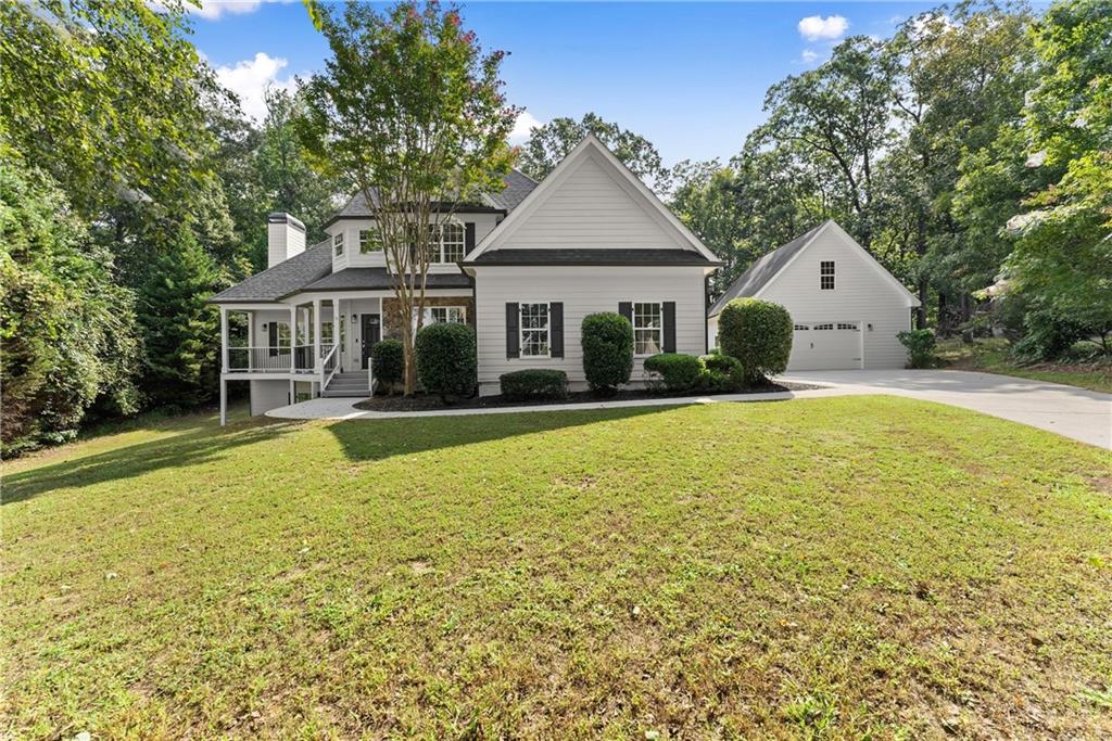 41 Doster Crest Road Jefferson, GA 30549 - Photo 2 of 56 a front view of house with yard and trees around