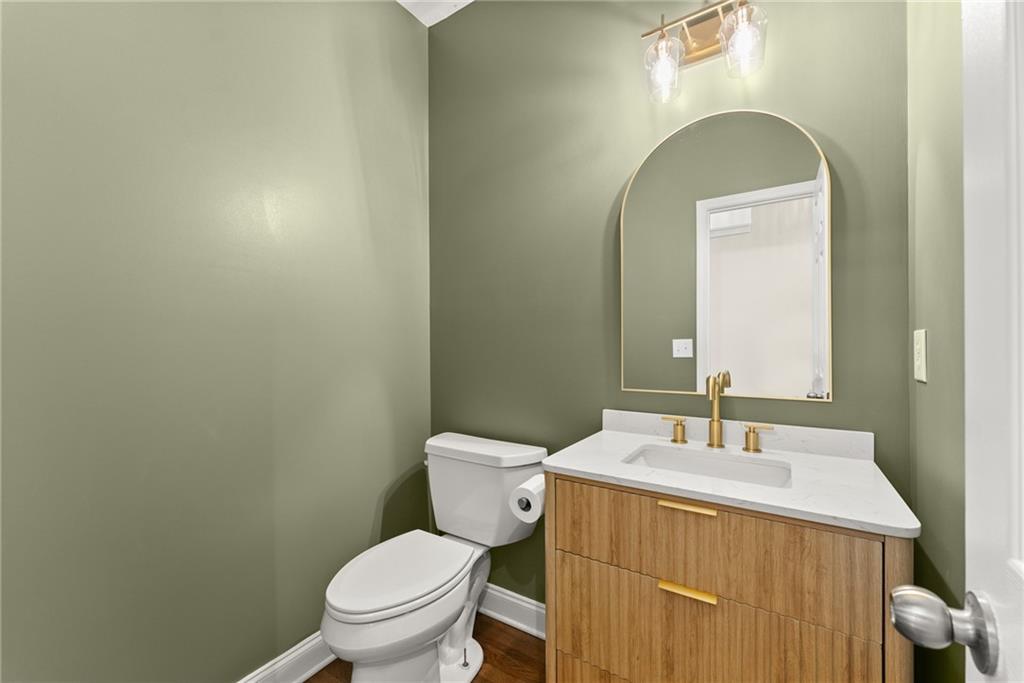 41 Doster Crest Road Jefferson, GA 30549 - Photo 23 of 56 a bathroom with a toilet a sink and mirror