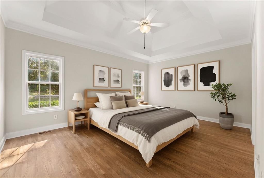 41 Doster Crest Road Jefferson, GA 30549 - Photo 25 of 56 a bedroom with a large bed and a chandelier