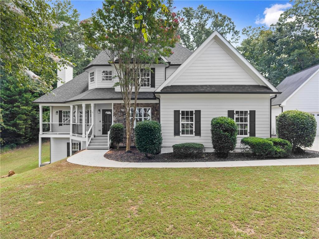 41 Doster Crest Road Jefferson, GA 30549 - Photo 3 of 56 a front view of a house with garden