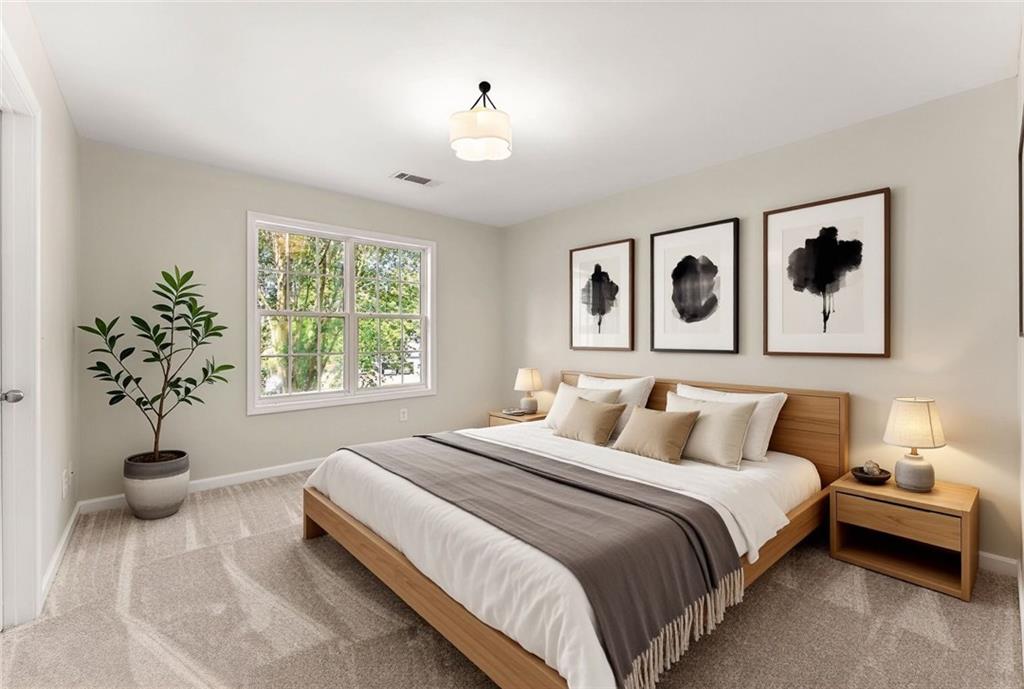 41 Doster Crest Road Jefferson, GA 30549 - Photo 33 of 56 a bedroom with a large bed and a window