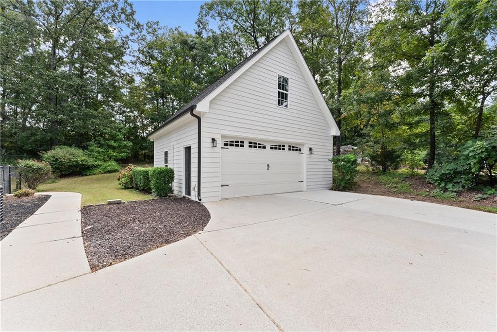 41 Doster Crest Road Jefferson, GA 30549 - Photo 42 of 56 a view of a house with a yard and garage