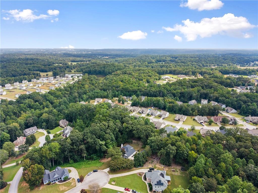 41 Doster Crest Road Jefferson, GA 30549 - Photo 53 of 56 an aerial view of a city with lots of residential buildings ocean and mountain view in back