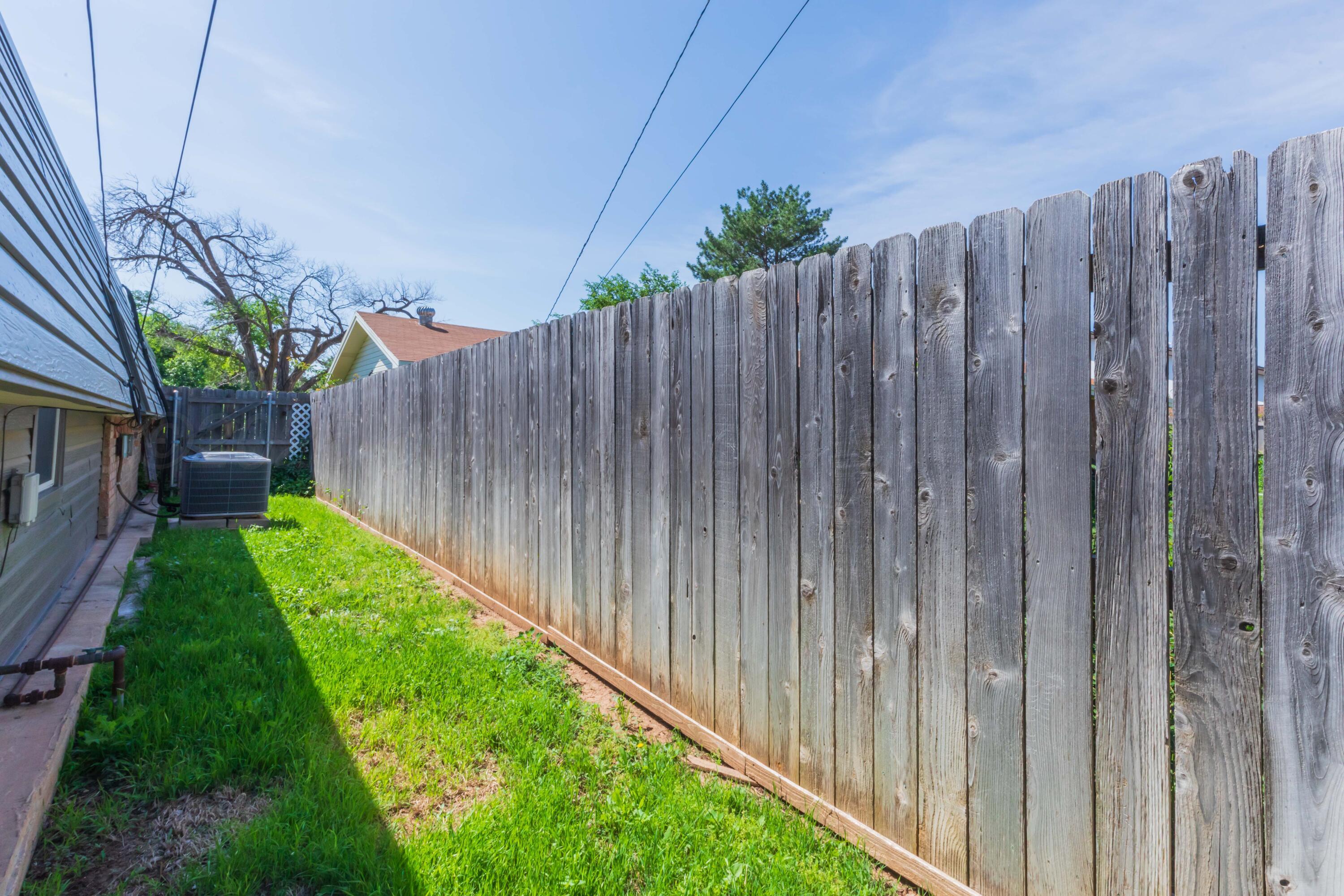 7000 Sunburst Street Amarillo, TX 79110 - Photo 31 of 32 a view of a backyard with wooden fence