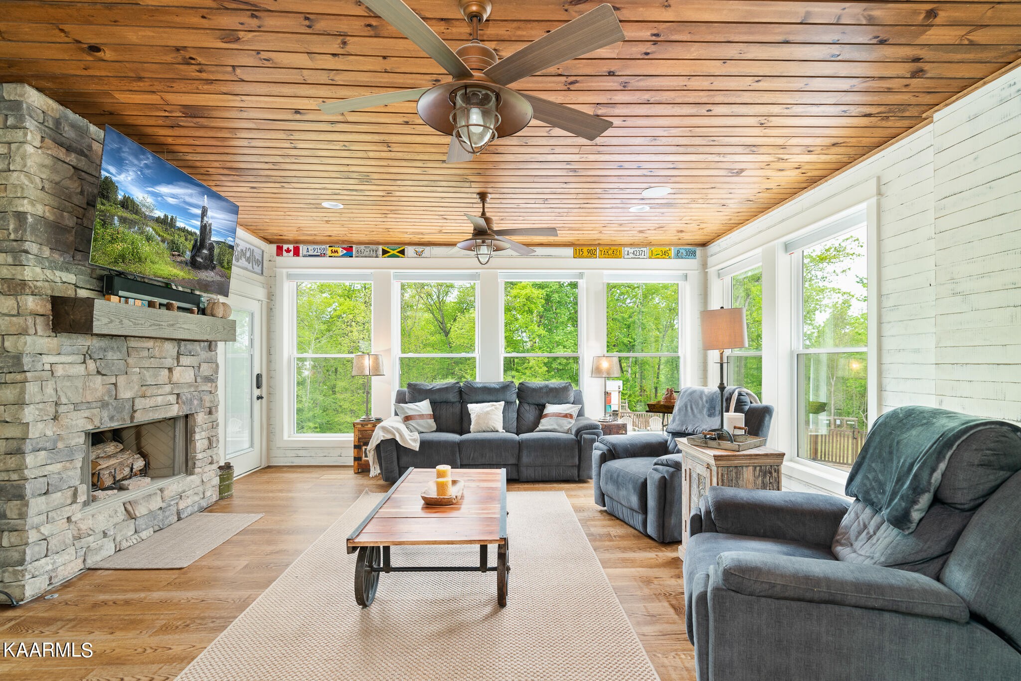 613 Dixon Road Lenoir City, TN 37772 - Photo 17 of 44 a living room with furniture a fireplace and a large window