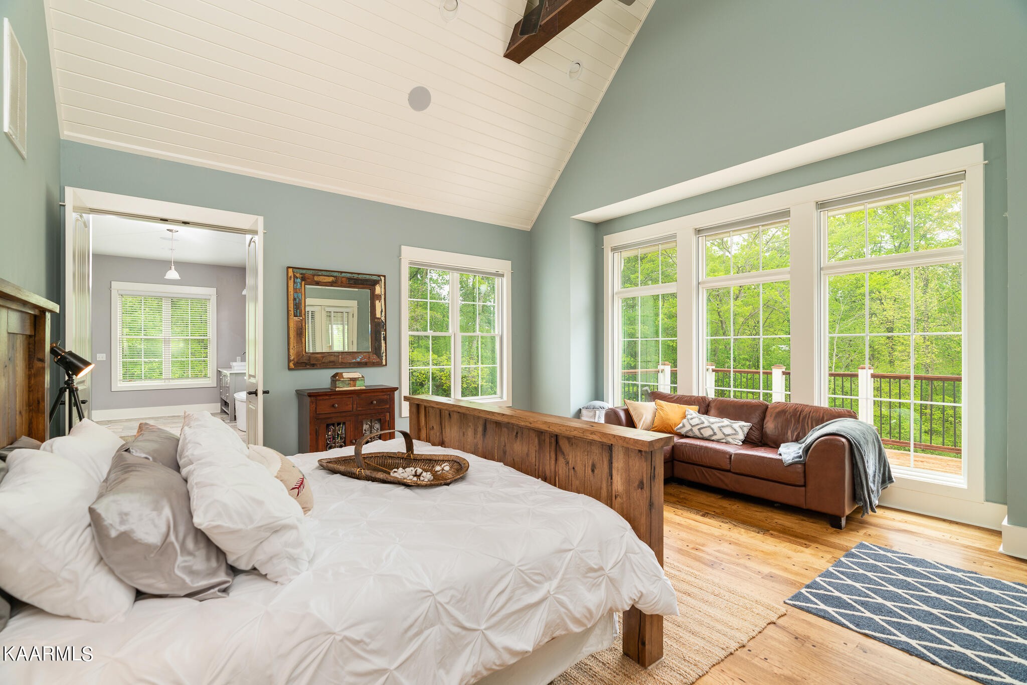 613 Dixon Road Lenoir City, TN 37772 - Photo 18 of 44 a bedroom with a bed a large window and a couch