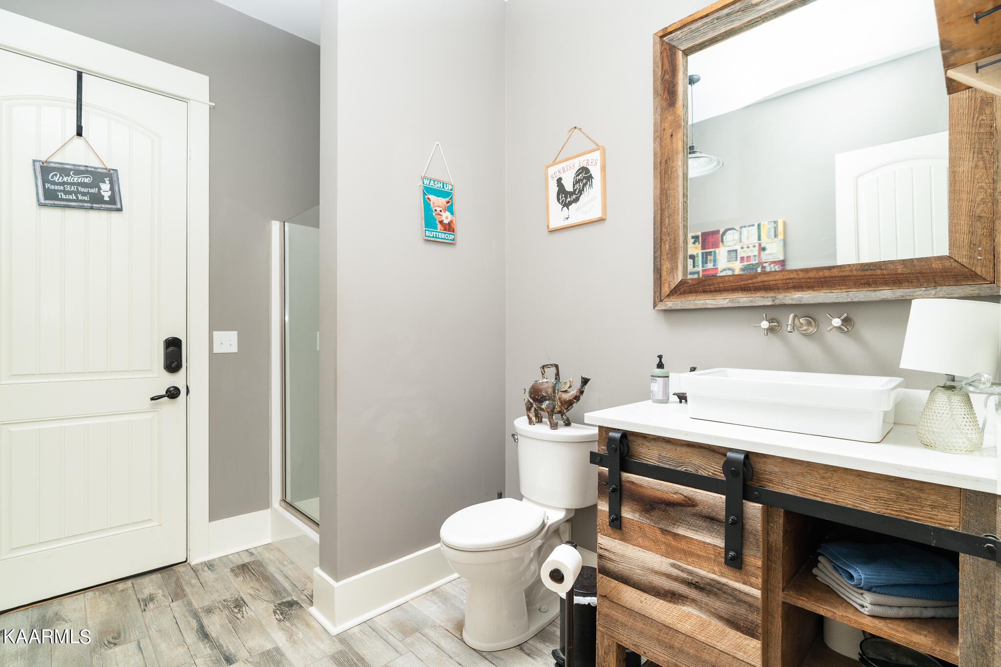 613 Dixon Road Lenoir City, TN 37772 - Photo 25 of 44 a bathroom with a sink toilet and mirror