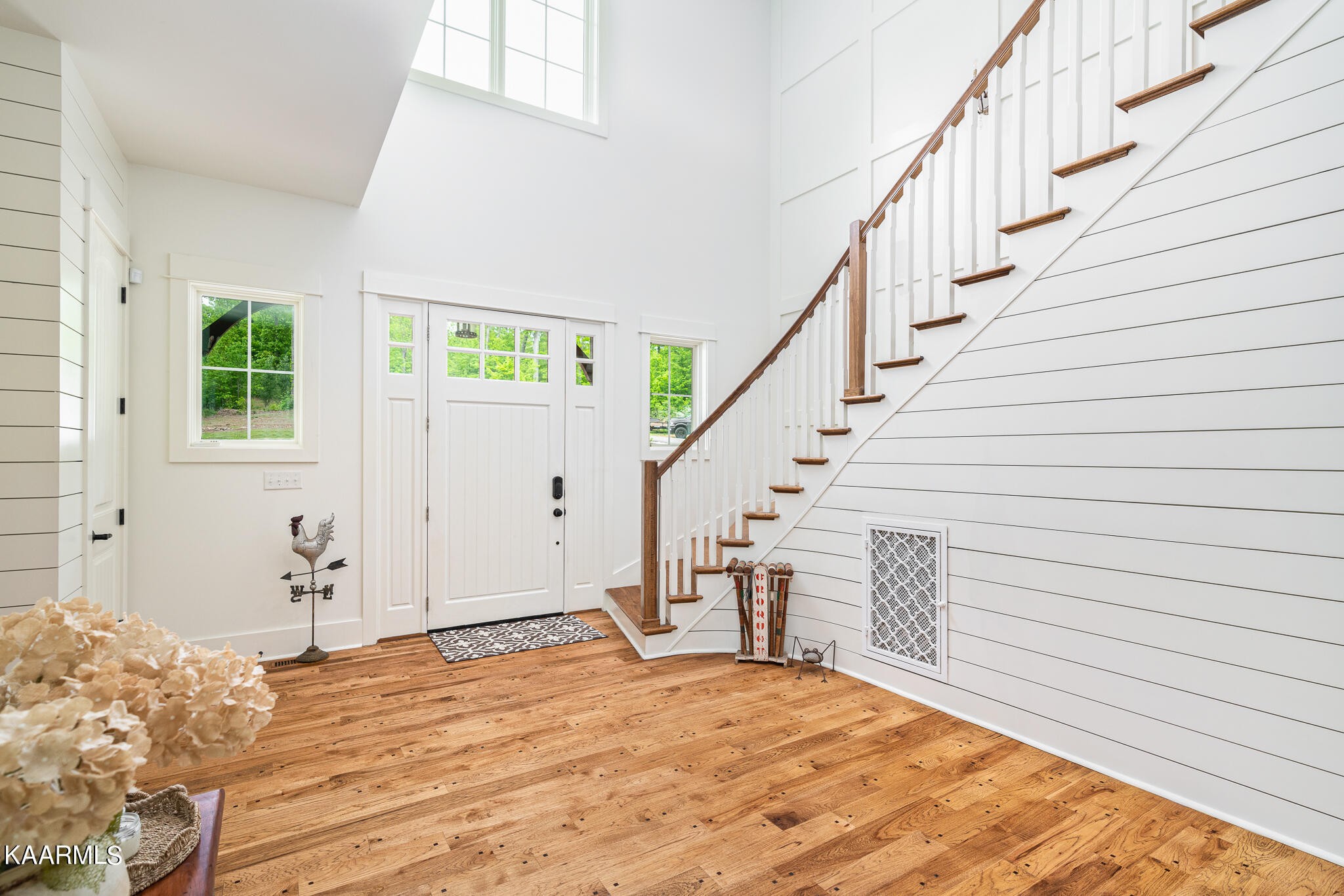 613 Dixon Road Lenoir City, TN 37772 - Photo 27 of 44 a view of a livingroom with wooden floor and stairs
