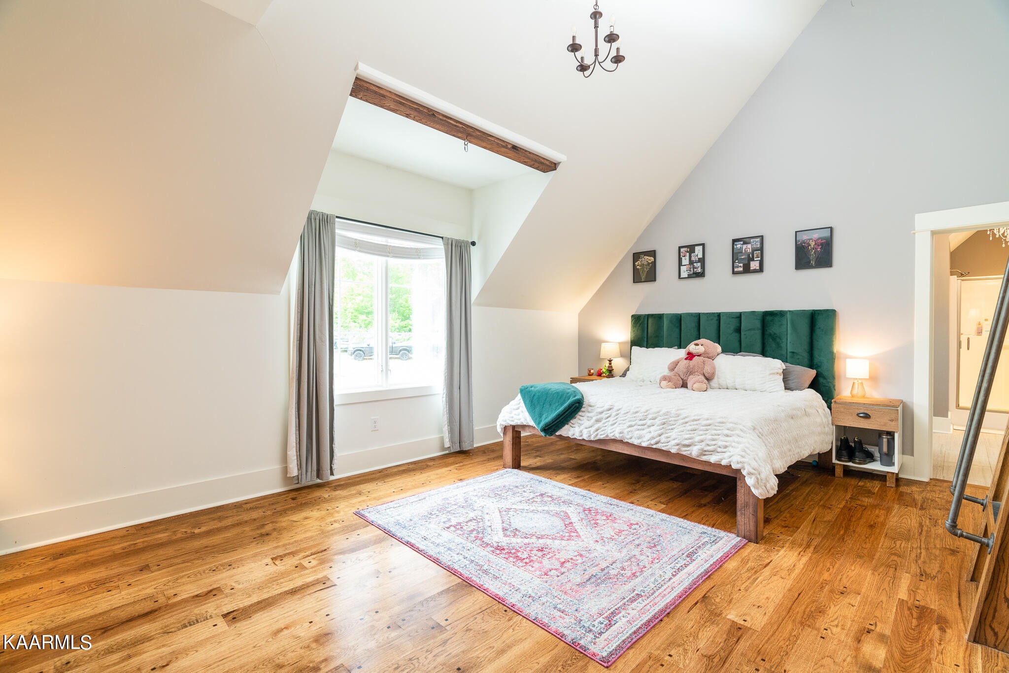 613 Dixon Road Lenoir City, TN 37772 - Photo 28 of 44 a bedroom with a bed and wooden floor