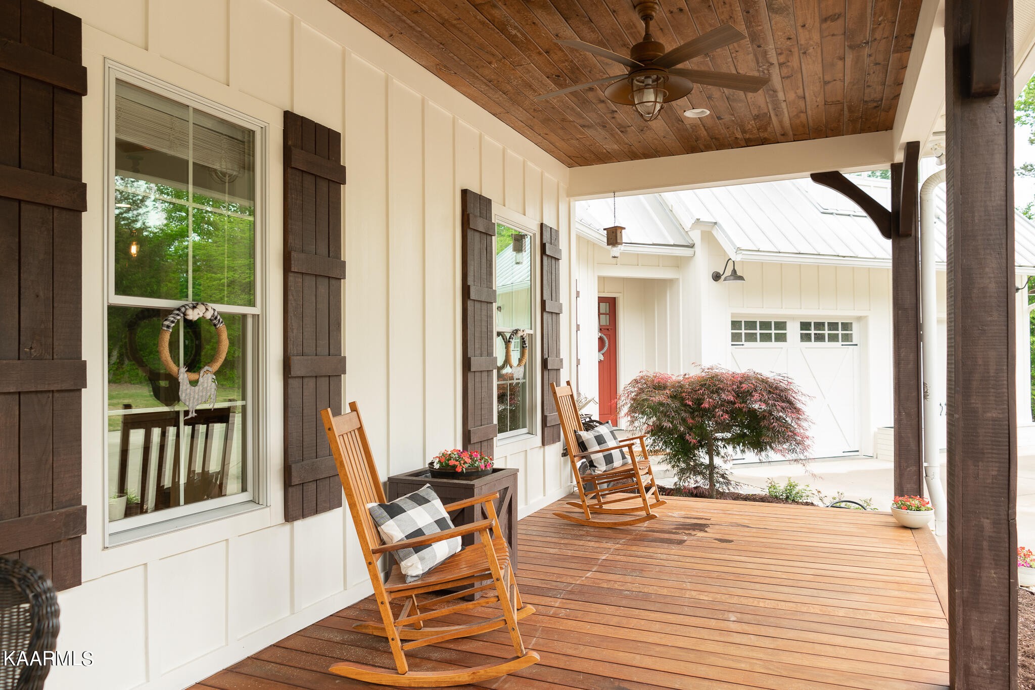 613 Dixon Road Lenoir City, TN 37772 - Photo 3 of 44 a view of a patio with a table and chairs and potted plants