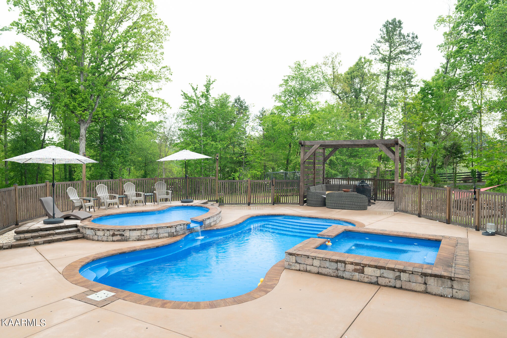 613 Dixon Road Lenoir City, TN 37772 - Photo 36 of 44 a view of a swimming pool with an outdoor seating