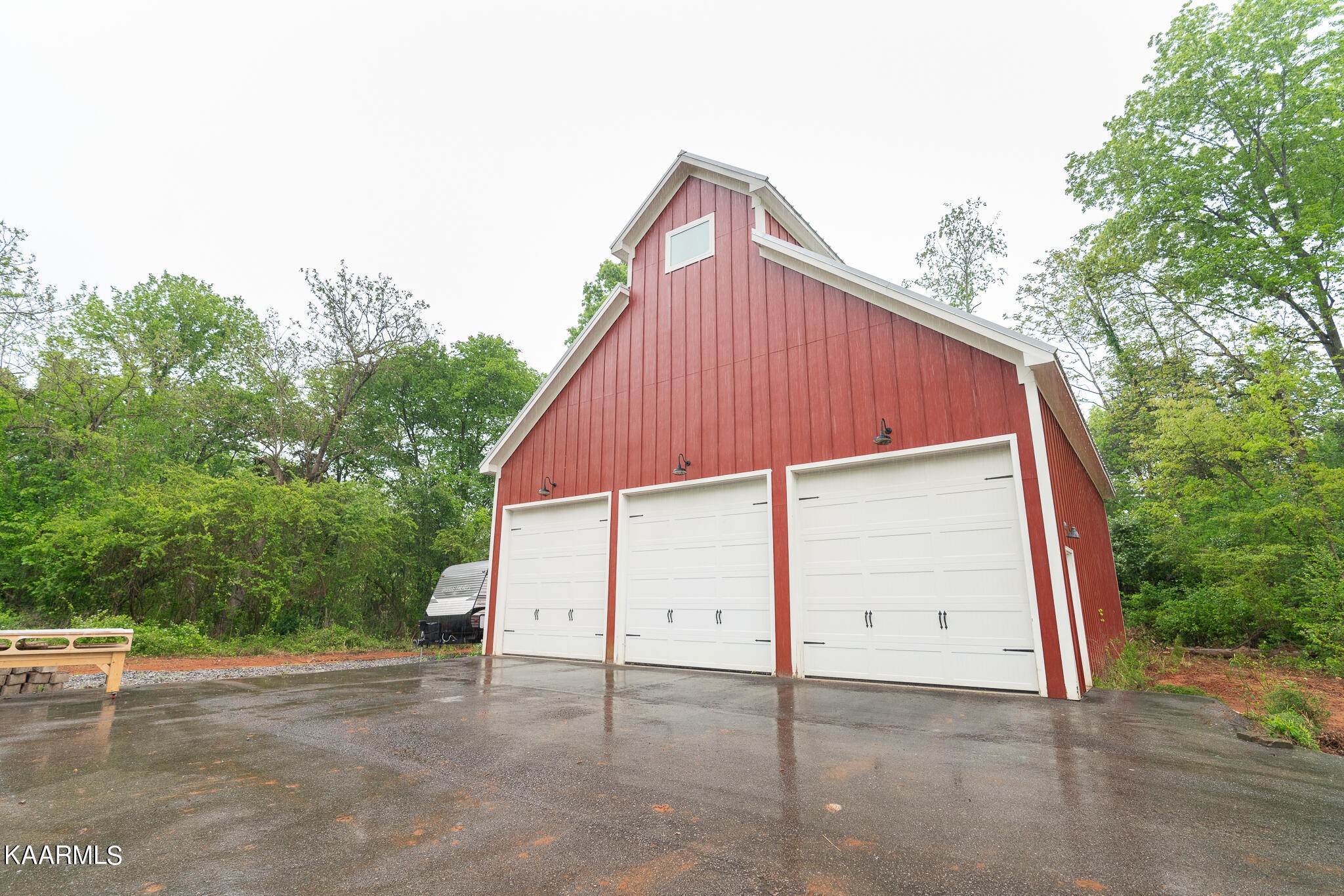 613 Dixon Road Lenoir City, TN 37772 - Photo 41 of 44 a view of a house with a yard and garage
