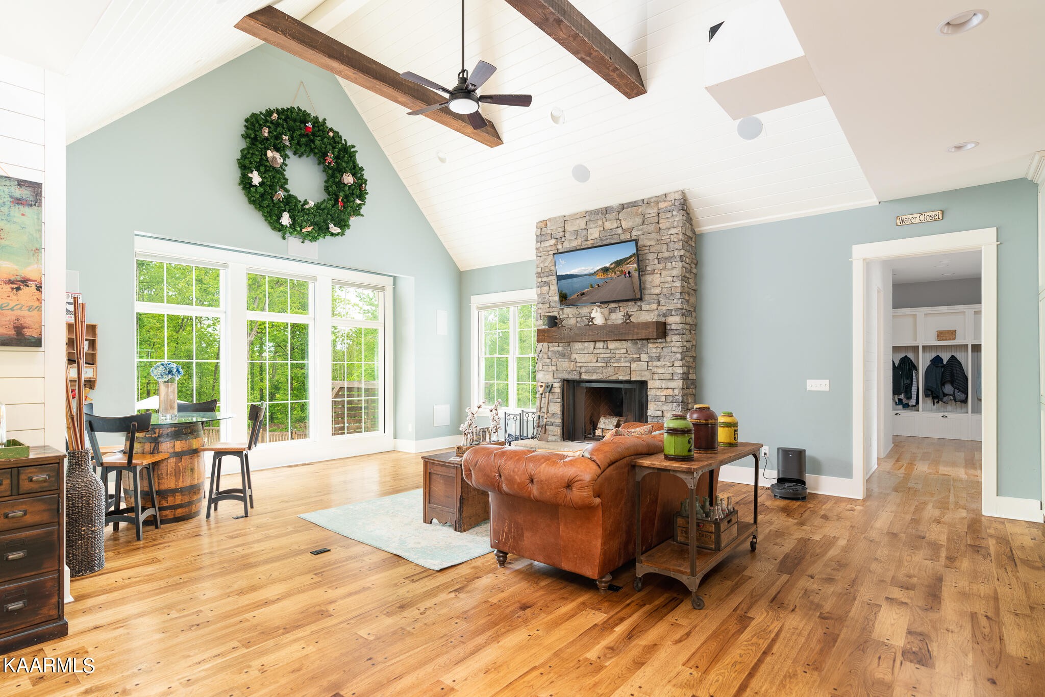 613 Dixon Road Lenoir City, TN 37772 - Photo 5 of 44 a living room with furniture a fireplace and a floor to ceiling window