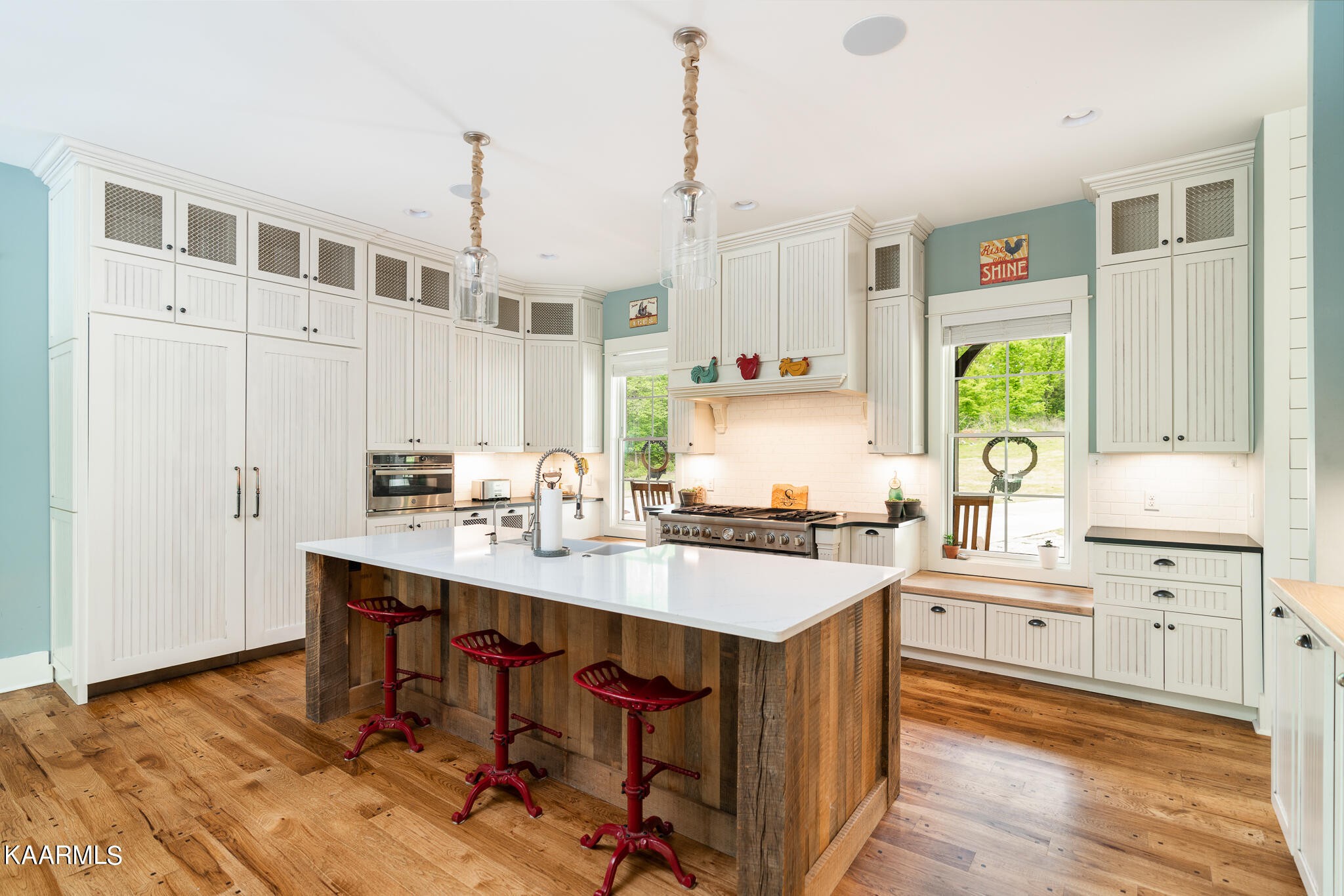 613 Dixon Road Lenoir City, TN 37772 - Photo 7 of 44 a kitchen with stainless steel appliances a sink a stove a refrigerator a center island and cabinets