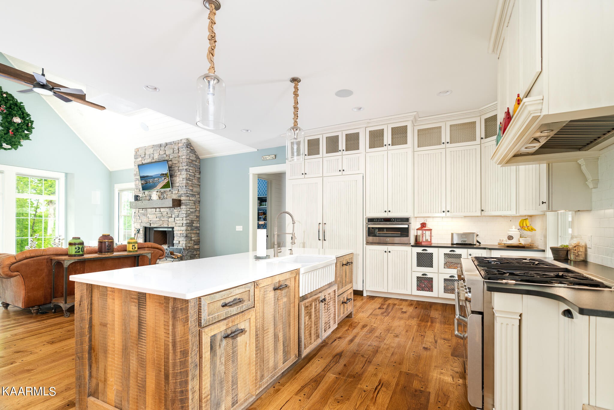 613 Dixon Road Lenoir City, TN 37772 - Photo 10 of 44 a kitchen with stainless steel appliances a sink stove and wooden floor