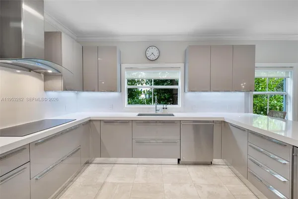 a kitchen with a cabinets and window