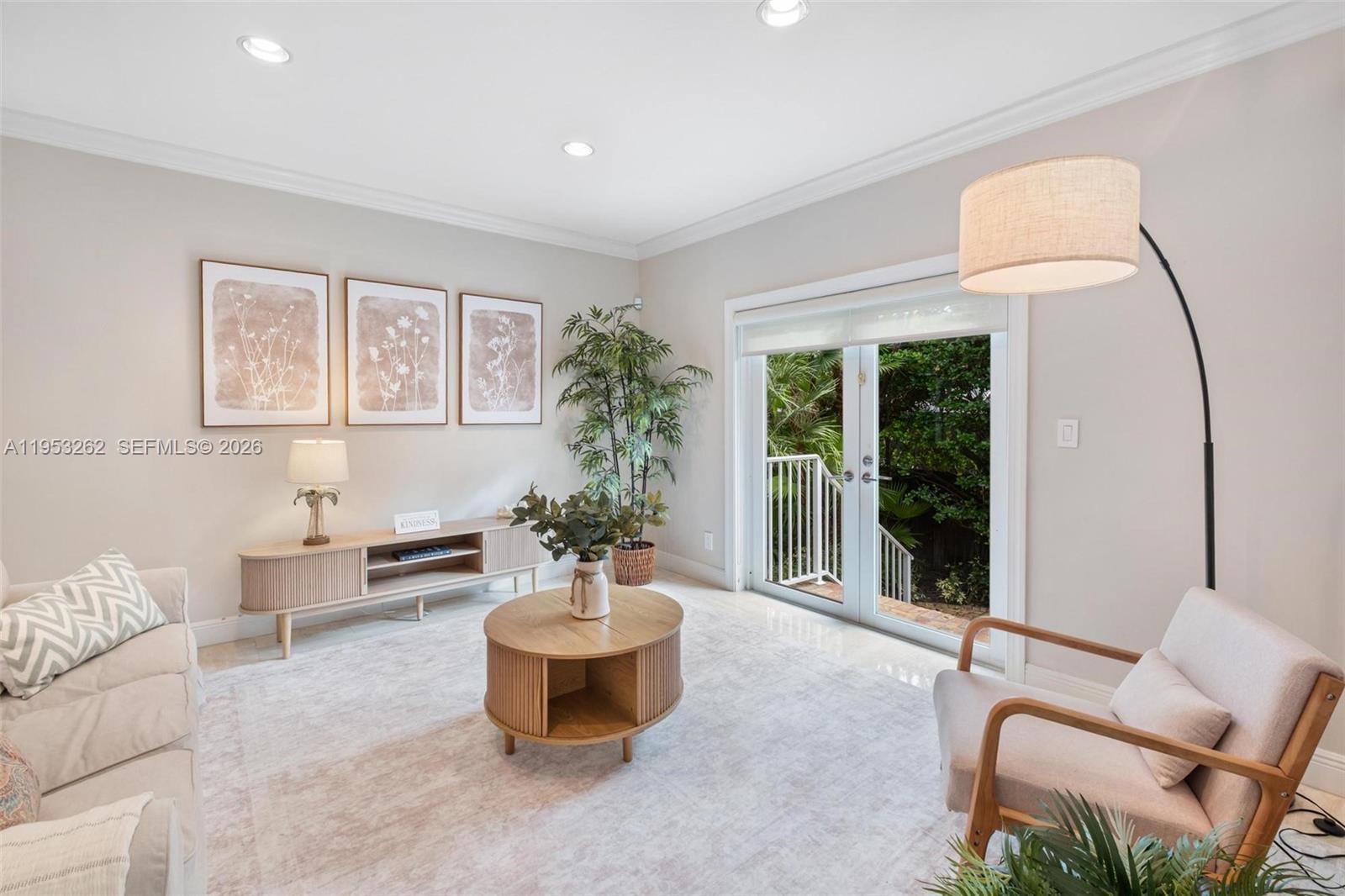 164 West Mashta Drive Key Biscayne, FL 33149 - Photo 15 of 34 a living room with furniture and a large window