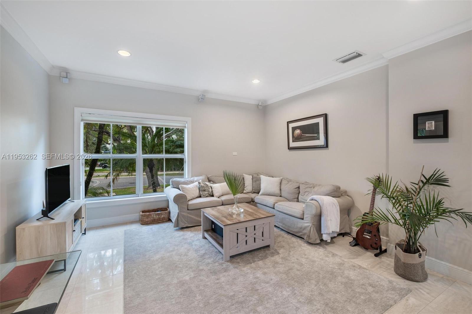 164 West Mashta Drive Key Biscayne, FL 33149 - Photo 17 of 34 a living room with furniture large window and a flat screen tv