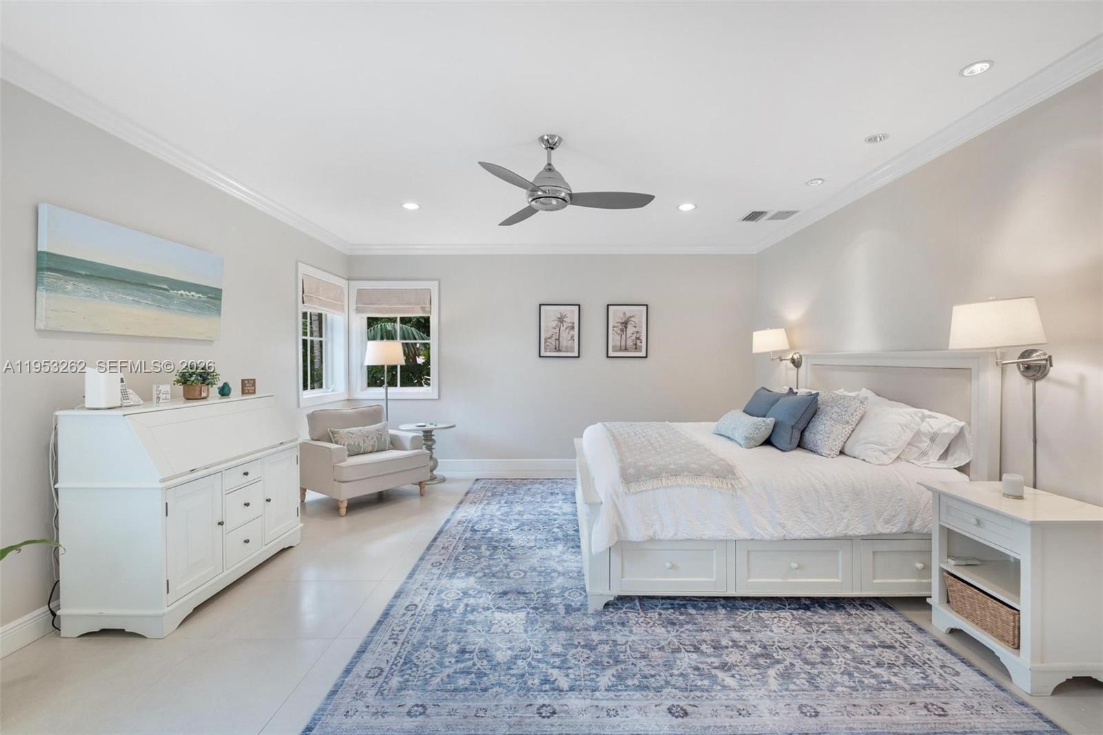 164 West Mashta Drive Key Biscayne, FL 33149 - Photo 18 of 34 a spacious bedroom with a bed and ceiling fan