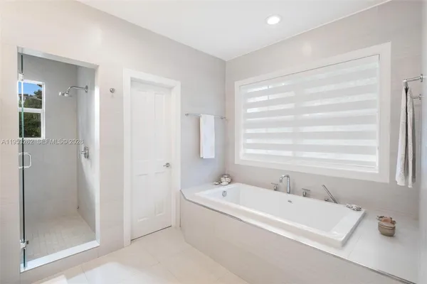 a bathroom with double sink and a mirror