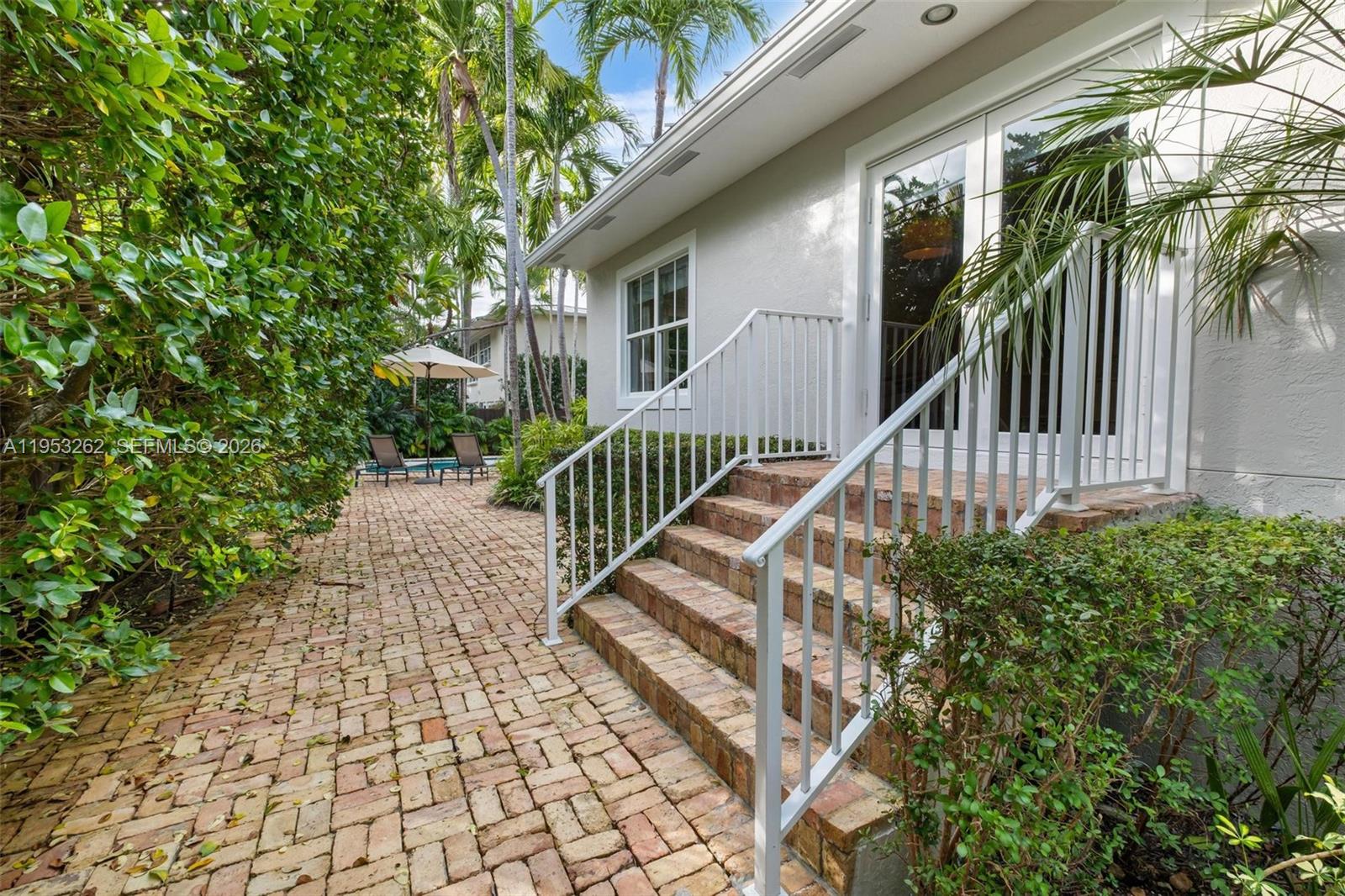 164 West Mashta Drive Key Biscayne, FL 33149 - Photo 30 of 34 a view of entryway with wooden stairs