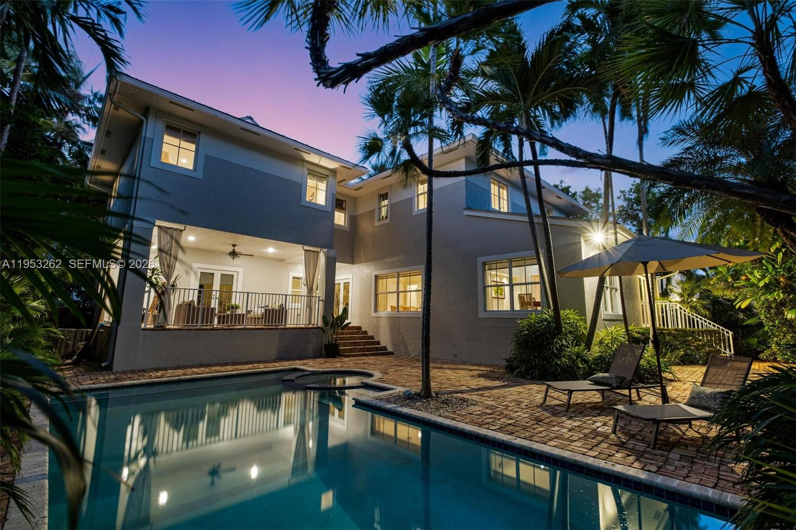 164 West Mashta Drive Key Biscayne, FL 33149 - Photo 3 of 34 a view of a house with a swimming pool